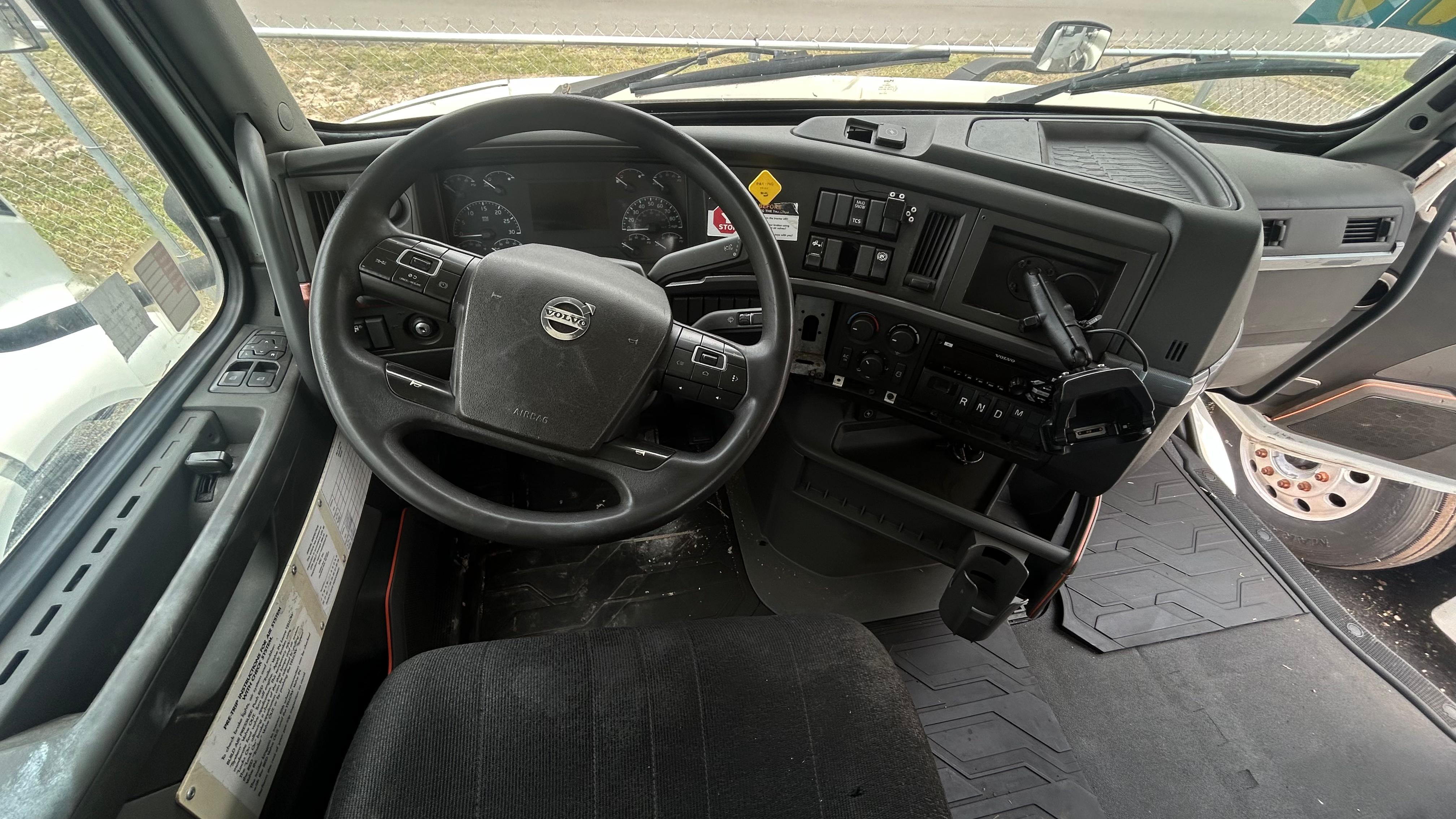 2019 Volvo Single Axle Day Cab driver dash and Volvo steering wheel